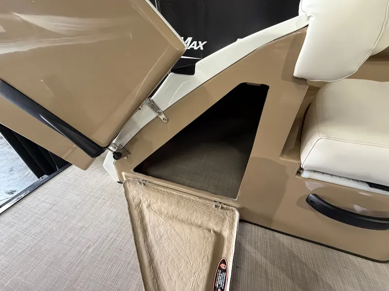 Slide: The Image of A storage compartment with an open hatch in a 2027 Harris 250CRW boat. - 16