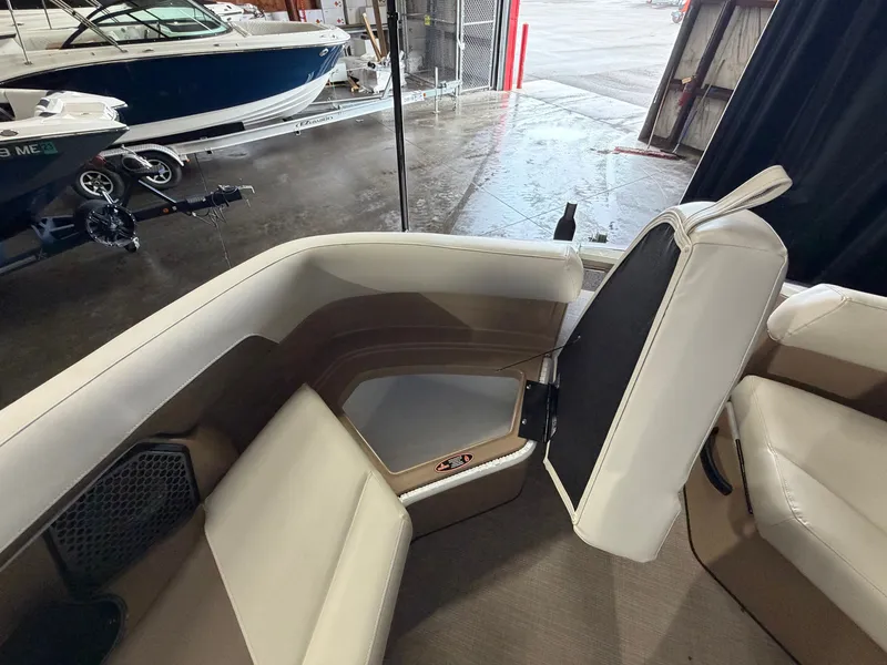 Slide: The Image of Interior of a 2027 Harris 250CRW with white and brown seating. - 26