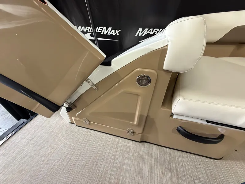 Slide: The Image of Close-up of a seating area with beige upholstery and storage compartment on a Harris 250CRW boat. - 17