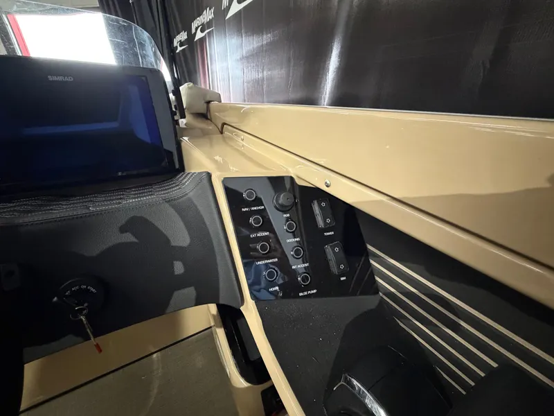 Slide: The Image of The image shows the dashboard of a 2027 Harris 250CRW with modern controls. - 42
