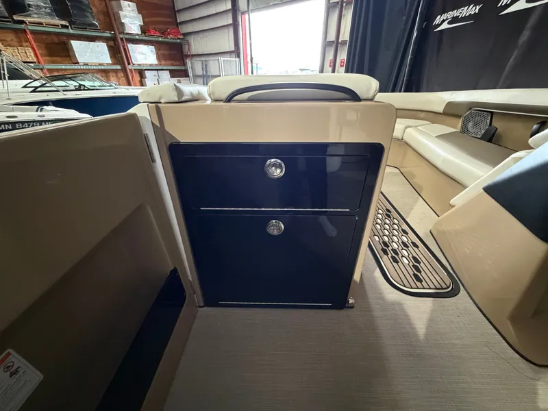 Slide: The Image of Interior of a 2027 Harris 250CRW with storage and seating area. - 38