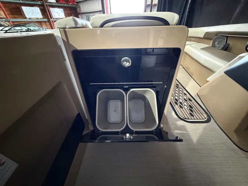 Slide: The Image of Interior view of a 2027 Harris 250CRW featuring a built-in trash bin. - 36