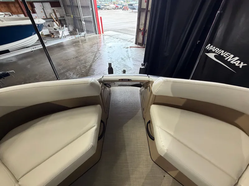 Slide: The Image of Interior view of a 2027 Harris 250CRW with beige seating and gray flooring. - 20