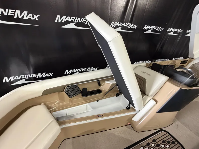Slide: The Image of The image shows the interior of a 2027 Harris 250CRW with an open storage compartment. - 24