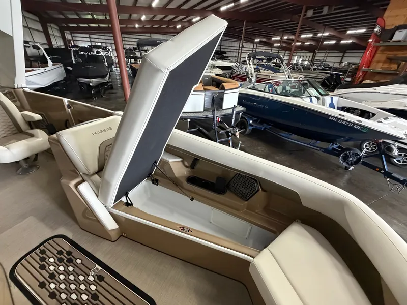 Slide: The Image of A 2027 Harris 250CRW in a warehouse. Open seat with storage compartment underneath. - 29