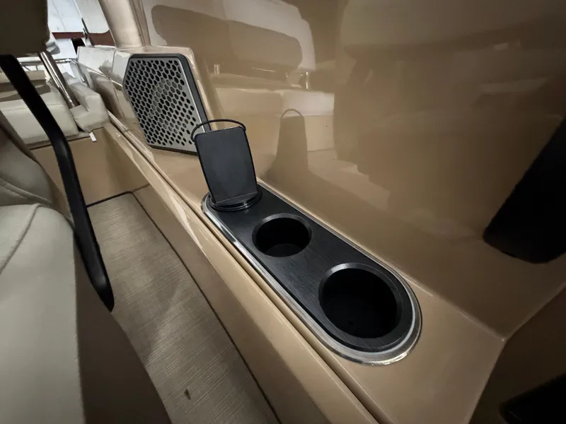 Slide: The Image of Interior of a Harris 250CRW with cup holders and a speaker. - 32