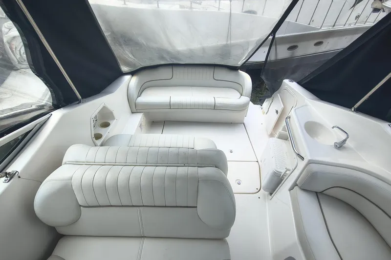 Slide: The Image of Interior of 2004 Chaparral Signature 240 boat with white seating and compact sink area. - 7