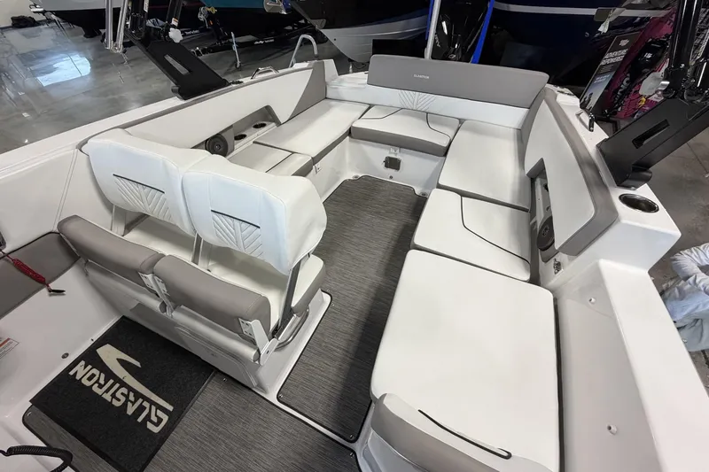 Slide: The Image of 2024 Glastron GTD 240 boat interior with spacious seating and modern design. - 16
