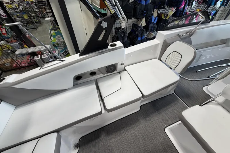 Slide: The Image of 2024 Glastron GTD 240 boat interior with white seating and modern design. - 21