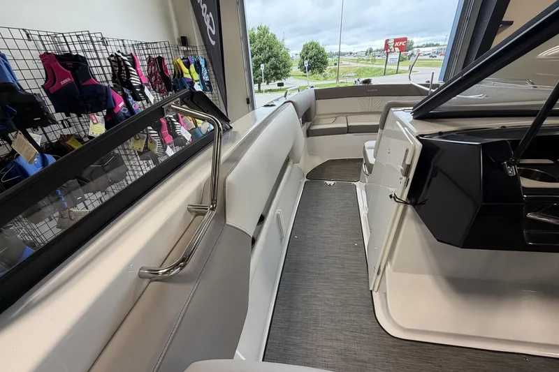 Slide: The Image of 2024 Glastron GTD 240 boat interior with seating and life jackets on display. - 22