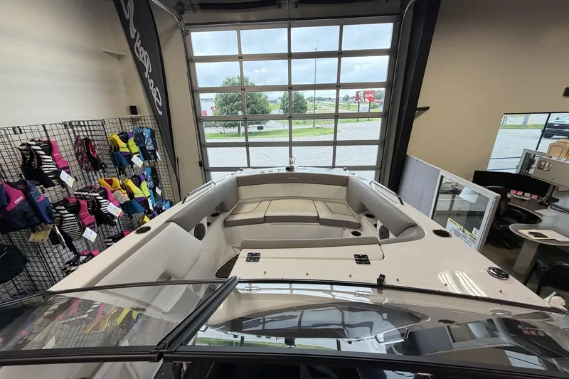 Slide: The Image of 2024 Glastron GTD 240 boat interior in showroom with life jackets displayed. - 24