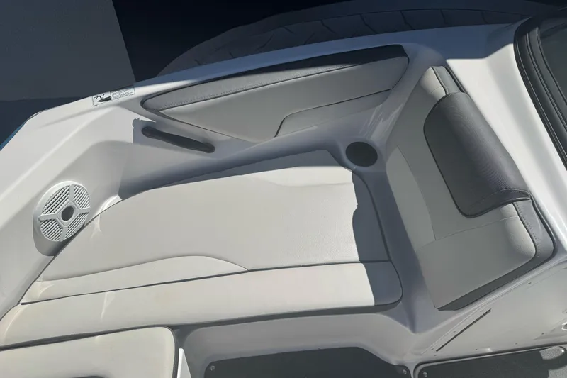 Slide: The Image of 2022 Yamaha Boats AR190 interior seating with speaker and cup holder. - 15