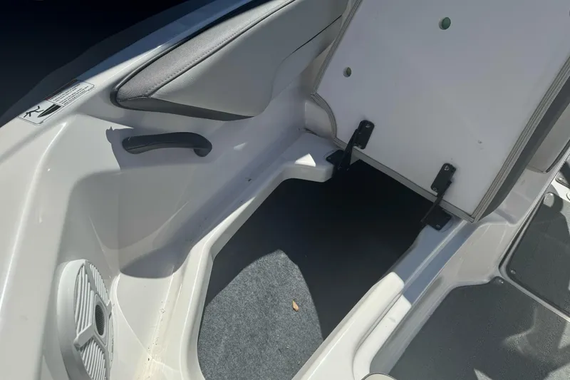 Slide: The Image of Interior view of a 2022 Yamaha Boats AR190, showcasing seating and storage area. - 18