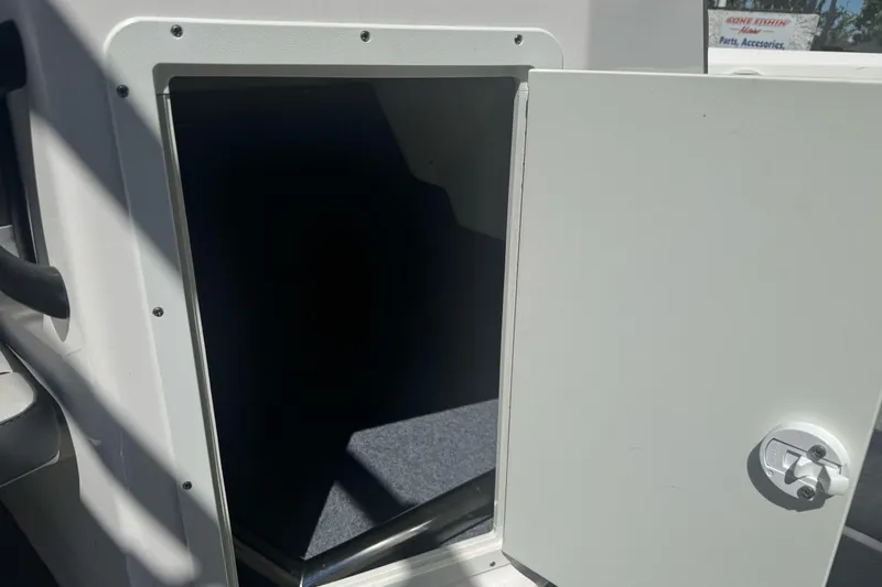Slide: The Image of Open storage compartment on a 2022 Yamaha Boats AR190. - 22