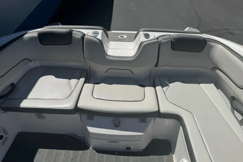 Slide: The Image of 2022 Yamaha Boats AR190 interior seating area with cushioned seats and sleek design. - 25