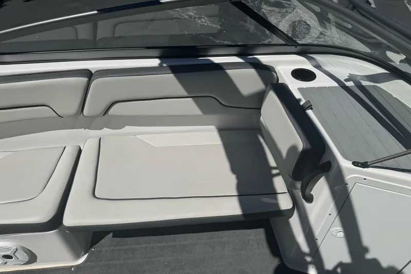 Slide: The Image of 2022 Yamaha AR190 boat interior with cushioned seating and cup holder. - 27
