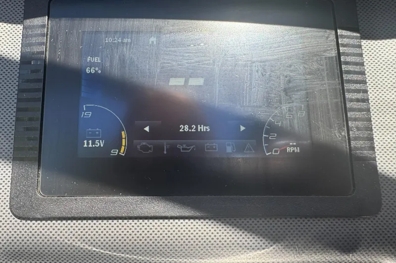 Slide: The Image of Dashboard display of a 2022 Yamaha Boats AR190 showing fuel level and engine hours. - 30