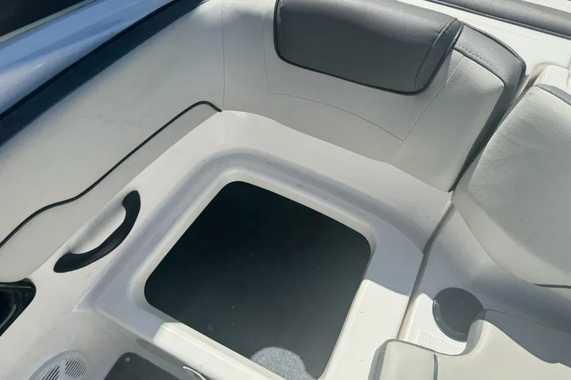 Slide: The Image of Interior seating area of a 2022 Yamaha Boats AR190, featuring sleek design and storage space. - 31