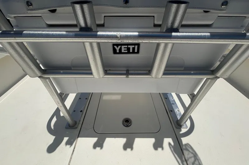 Slide: The Image of 2014 Mako 21 LTS boat with Yeti cooler and rod holders on deck. - 16