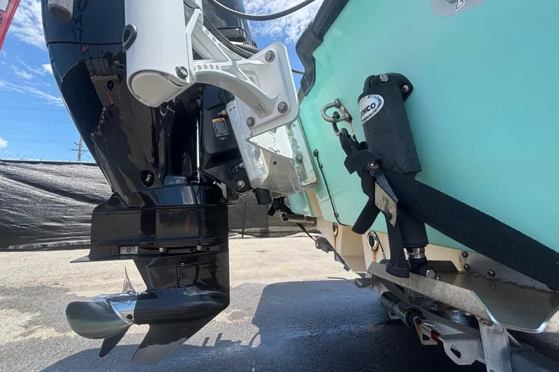Slide: The Image of 2014 Mako 21 LTS boat engine and trim system, close-up view. - 3