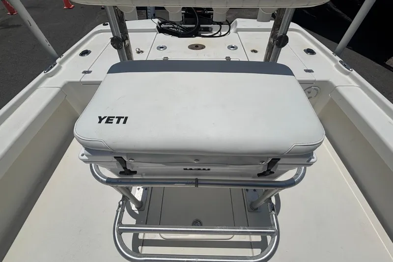 Slide: The Image of 2014 Mako 21 LTS boat with Yeti cooler seat on deck. - 41