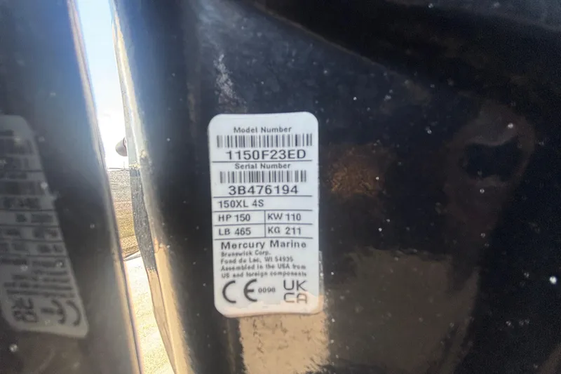 Slide: The Image of Label on a 2014 Mako 21 LTS boat, displaying Mercury Marine engine specifications. - 49