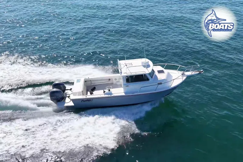 The Image of 2021 Parker 2520 XLD Sport Cabin boat cruising on open water. - 0
