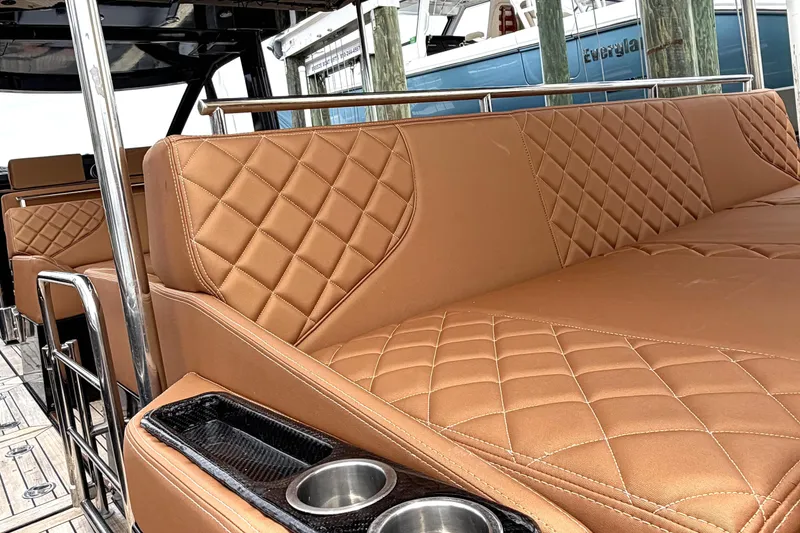 Slide: The Image of Luxurious leather seating on a 2013 Windy SR52 yacht, featuring elegant diamond stitching. - 14