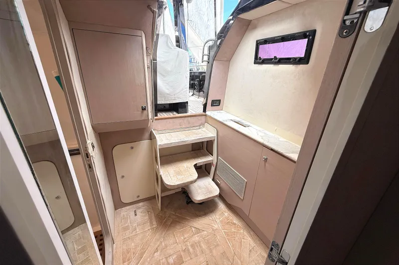 Slide: The Image of Interior of 2013 Windy SR52 yacht with wooden cabinetry and compact design. - 19