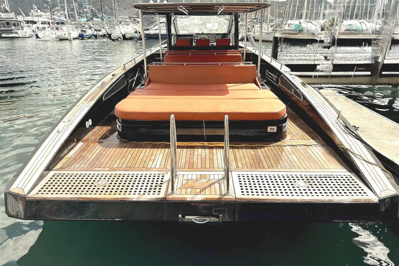 Slide: The Image of Luxury Windy SR52 yacht, 2013 model, docked at marina with wooden deck and orange seating. - 5