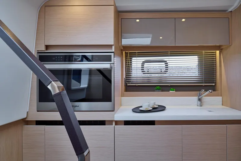 Slide: The Image of Modern kitchen interior of 2027 Jeanneau DB/43 OB yacht with sleek cabinetry and appliances. - 10