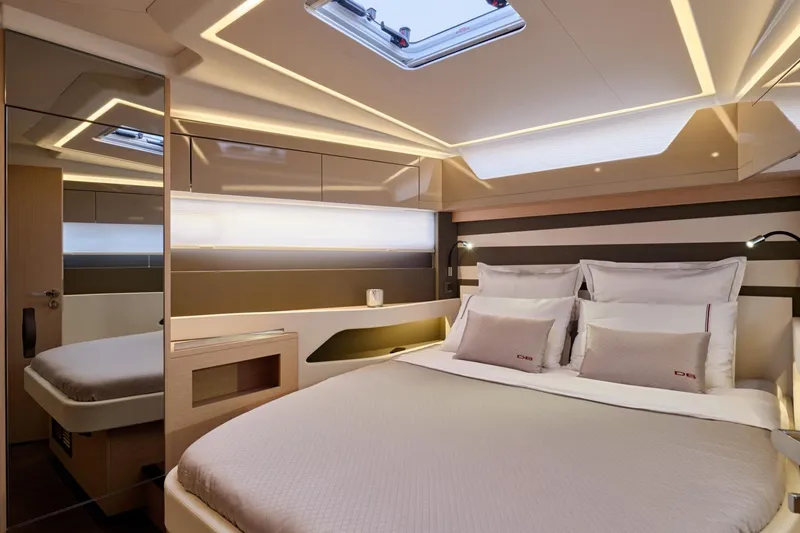Slide: The Image of Luxurious cabin interior of 2027 Jeanneau DB/43 OB yacht with modern lighting. - 12