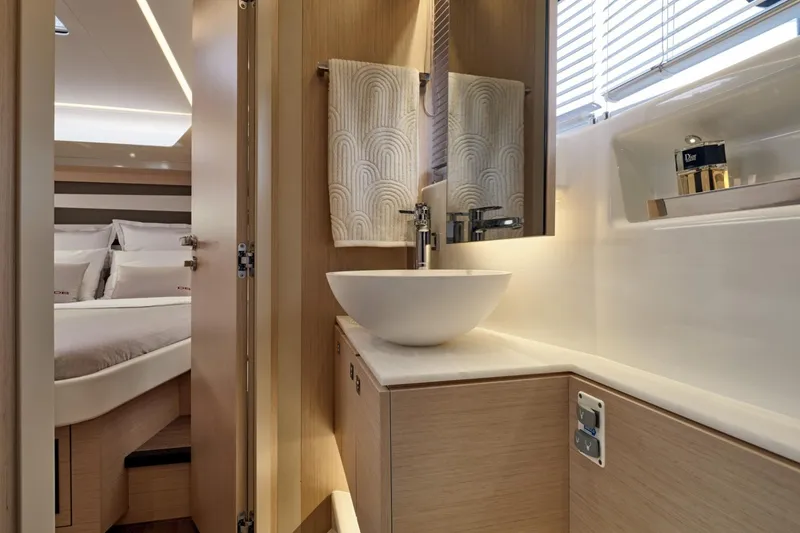 Slide: The Image of Luxurious bathroom interior of 2027 Jeanneau DB/43 OB yacht with modern sink and elegant design. - 15