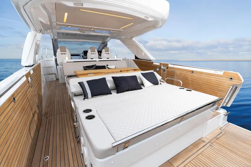 Slide: The Image of Luxurious 2027 Jeanneau DB/43 OB yacht interior with elegant seating and ocean view. - 7