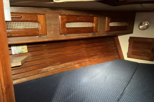 Slide: The Image of Cozy cabin interior of 1985 Islander Peterson 40 sailboat with wooden cabinetry. - 16