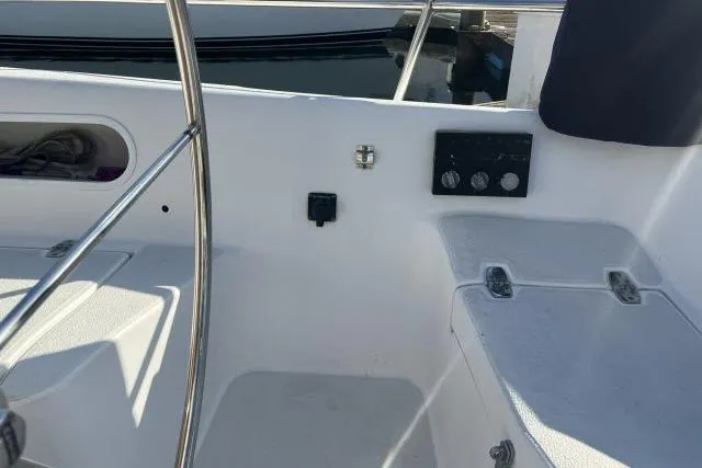 Slide: The Image of Cockpit view of 1985 Islander Peterson 40 sailboat, featuring steering wheel and control panel. - 21
