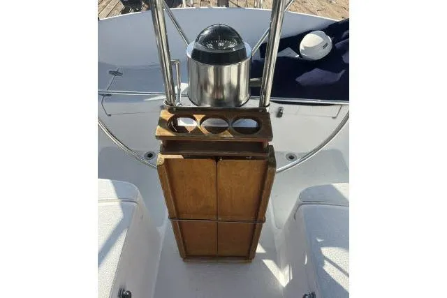Slide: The Image of Cockpit of 1985 Islander Peterson 40 sailboat with compass and wooden storage. - 22