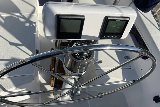 Slide: The Image of Steering wheel and navigation instruments on 1985 Islander Peterson 40 sailboat. - 23