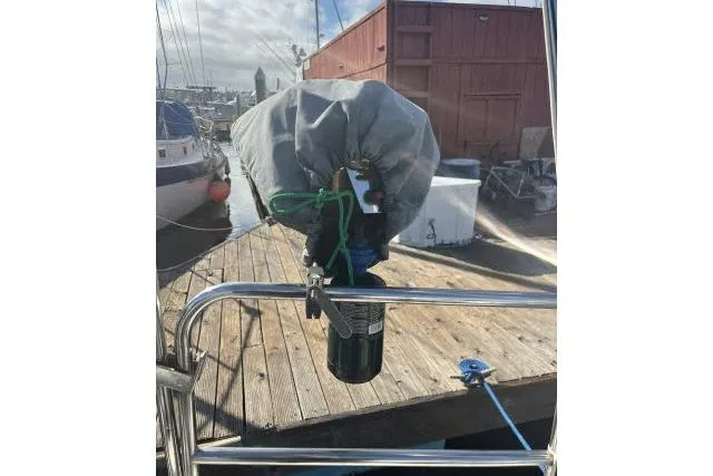 Slide: The Image of Covered outboard motor on 1985 Islander Peterson 40 sailboat at dock. - 25