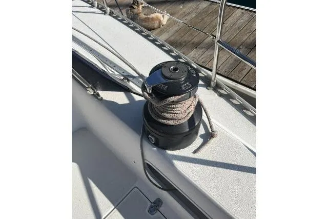 Slide: The Image of Winch on 1985 Islander Peterson 40 sailboat deck with coiled rope. - 27