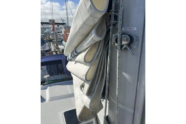 Slide: The Image of Folded sail on 1985 Islander Peterson 40 yacht, docked in marina. - 29