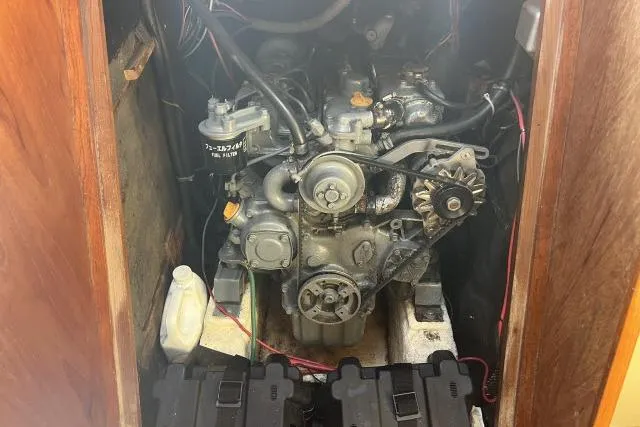 Slide: The Image of Engine compartment of a 1985 Islander Peterson 40 sailboat, showcasing mechanical components. - 35