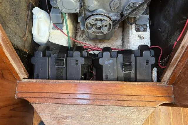 Slide: The Image of Engine compartment of 1985 Islander Peterson 40 sailboat with batteries and wiring. - 36
