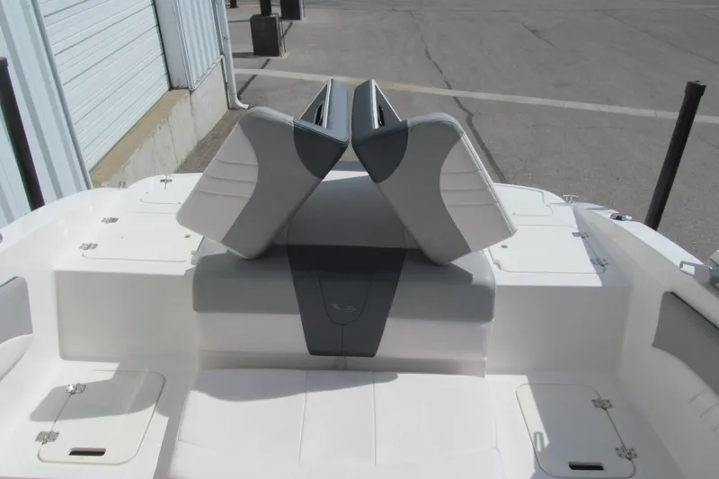 Slide: The Image of 2019 Chaparral 21 H2O Sport boat interior with adjustable seating and storage compartments. - 13