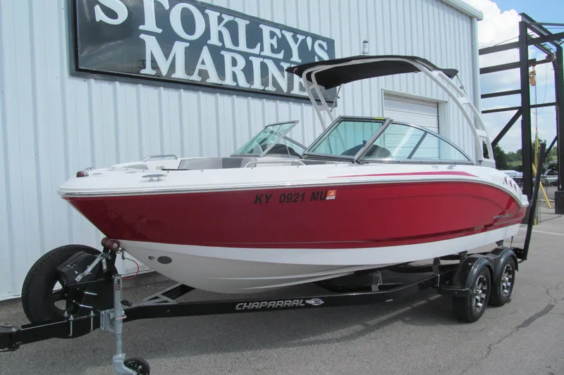 Slide: The Image of 2019 Chaparral 21 H2O Sport boat in red, parked at Stokley's Marine. - 2