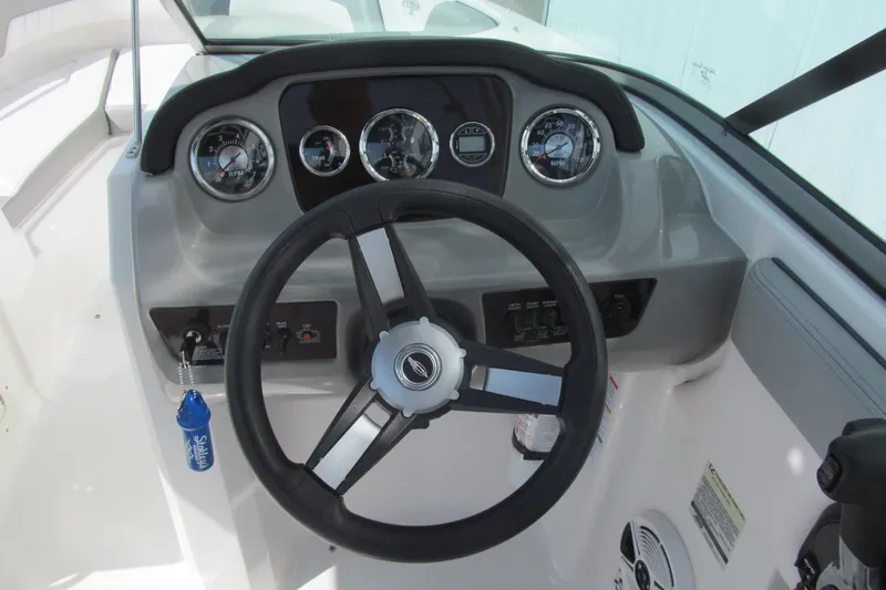 Slide: The Image of Steering console of 2019 Chaparral 21 H2O Sport boat with gauges and controls. - 6