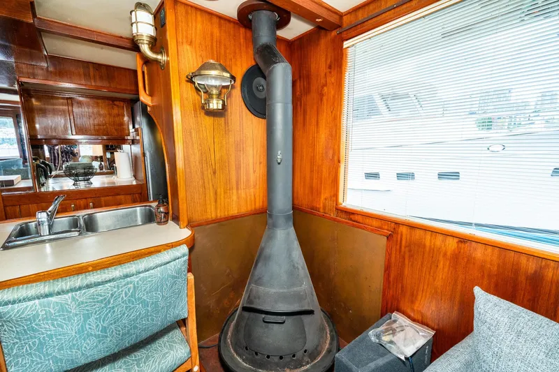 Slide: The Image of Interior of 1971 Philbrook's Trawler with wood paneling and stove. - 10