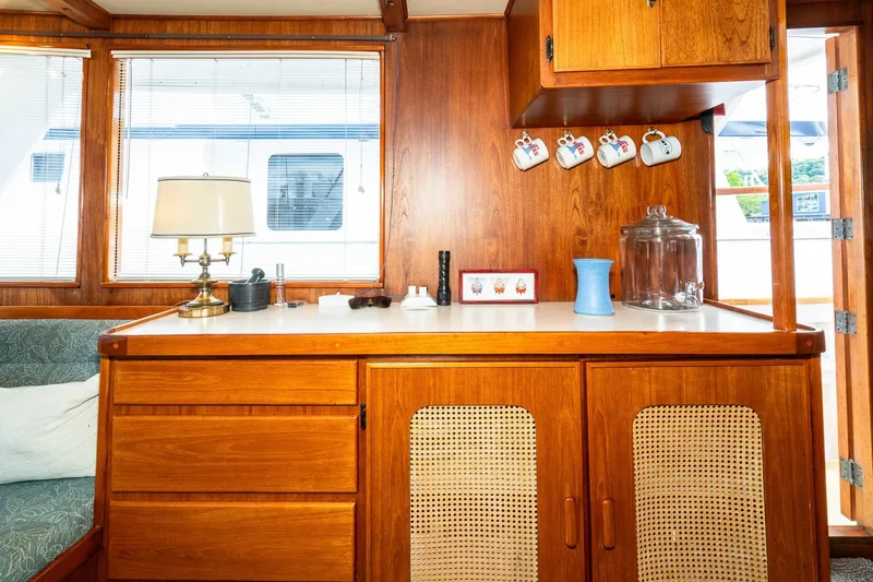 Slide: The Image of Interior of a 1971 Philbrook's Trawler with wooden furniture and decor. - 11