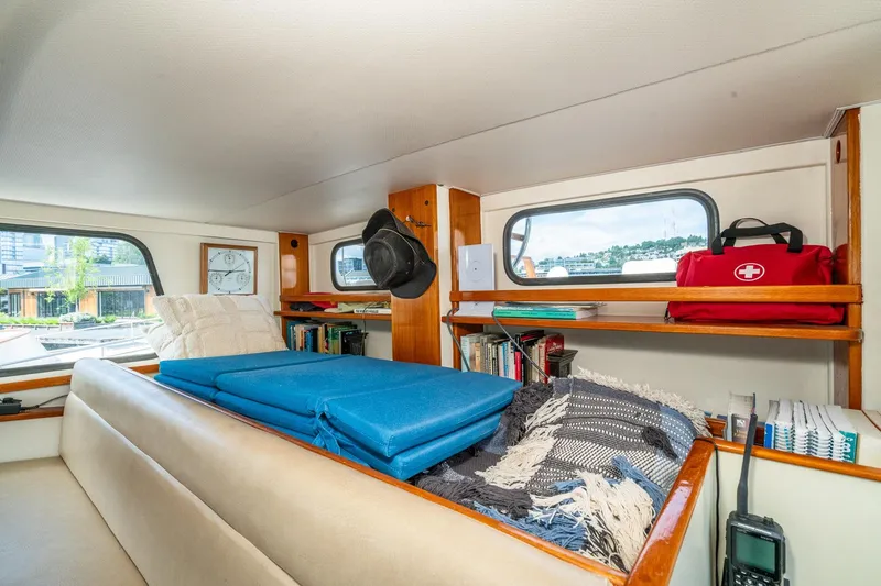 Slide: The Image of Interior of a 1971 Philbrook's Trawler with bookshelf and first aid kit. - 18