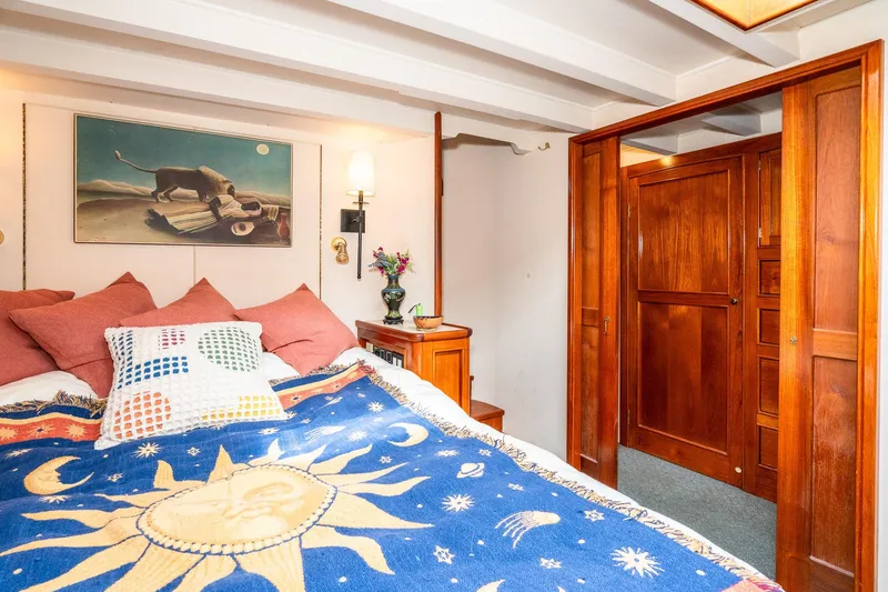 Slide: The Image of Cozy bedroom on 1971 Philbrook's Trawler with wooden furnishings. - 34
